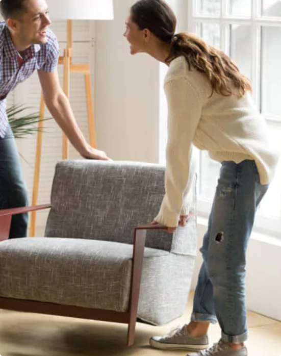 Couple Shifting Furniture | Crest Flooring